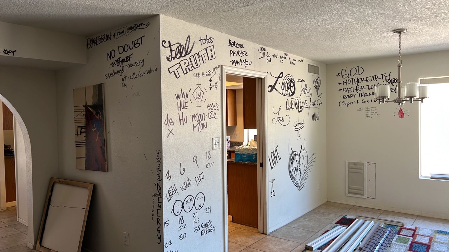 A room with a lot of writing on the walls.