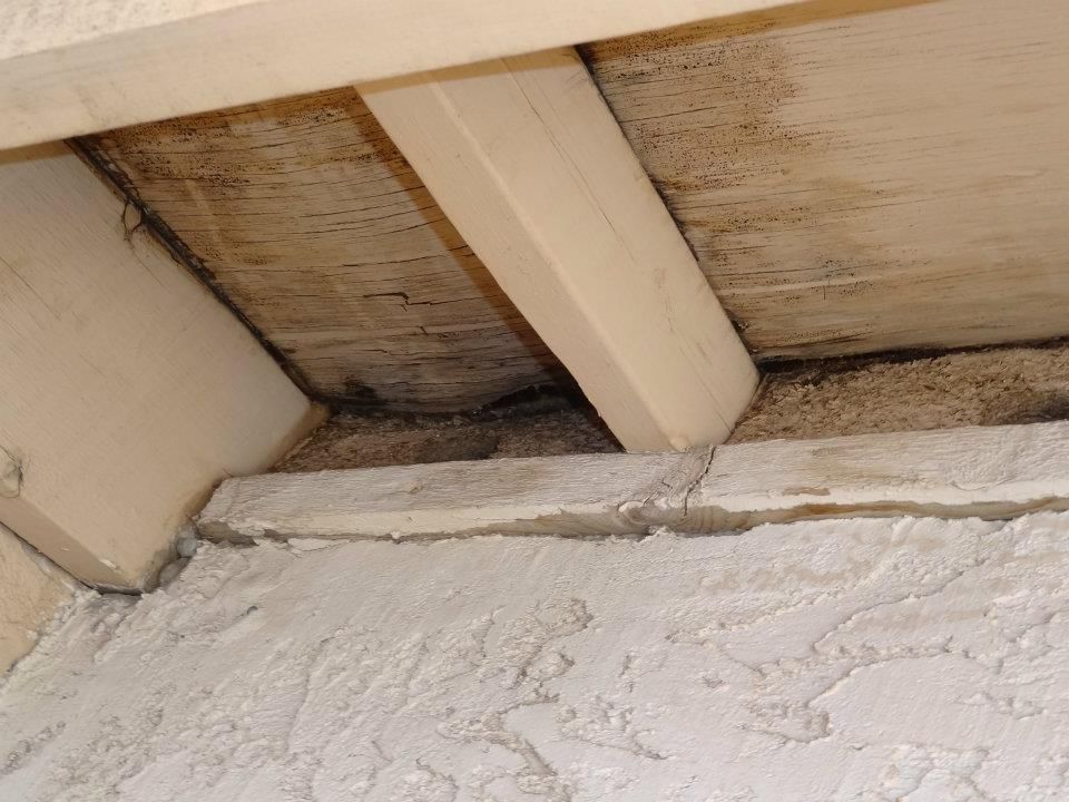 A close up of a wooden beam on a wall