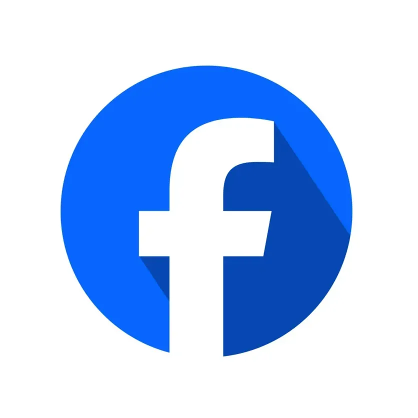 The facebook logo is in a blue circle with a long shadow.