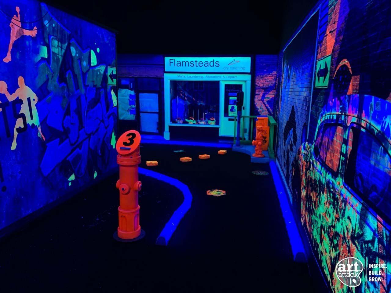 HD Black Light mini golf hole featuring tiger course designed and installed by art attack