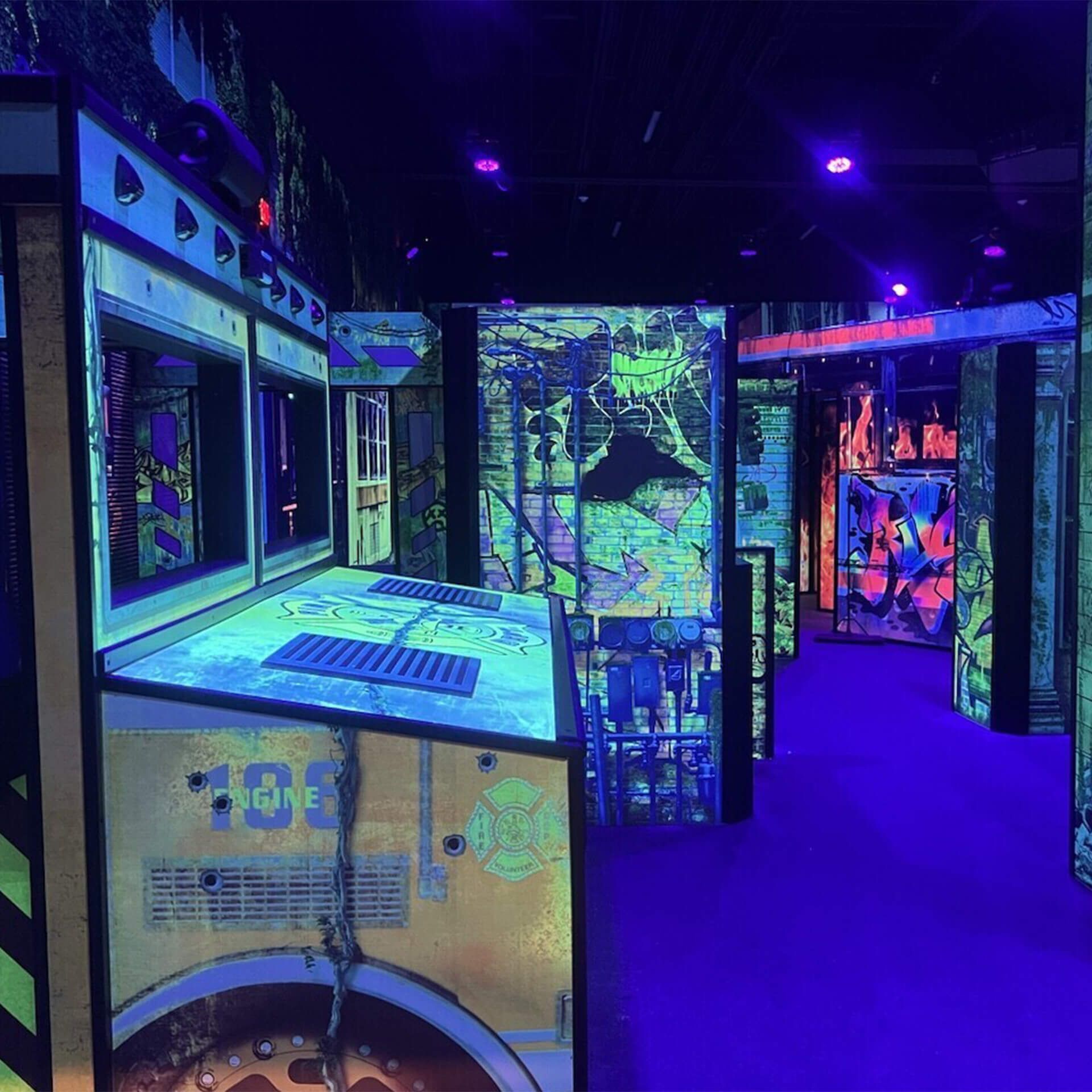 Black light reactive laser tag arena builders