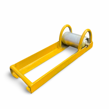 A yellow metal object with a metal roller on it