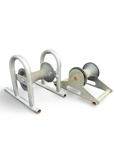 A pair of rollers sitting next to each other on a white surface.