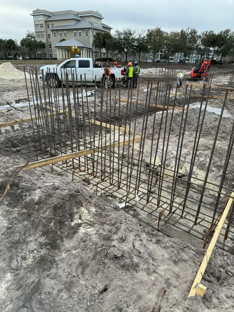 A construction site with a truck parked in the middle of it.