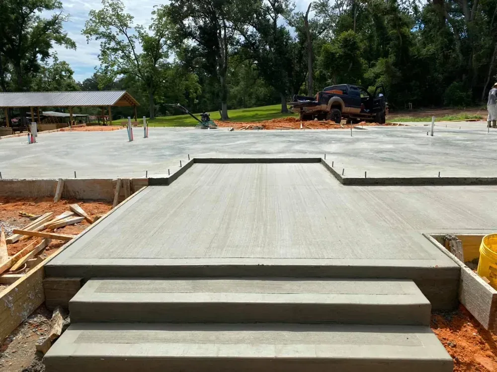 A truck is parked in the background of a construction site.