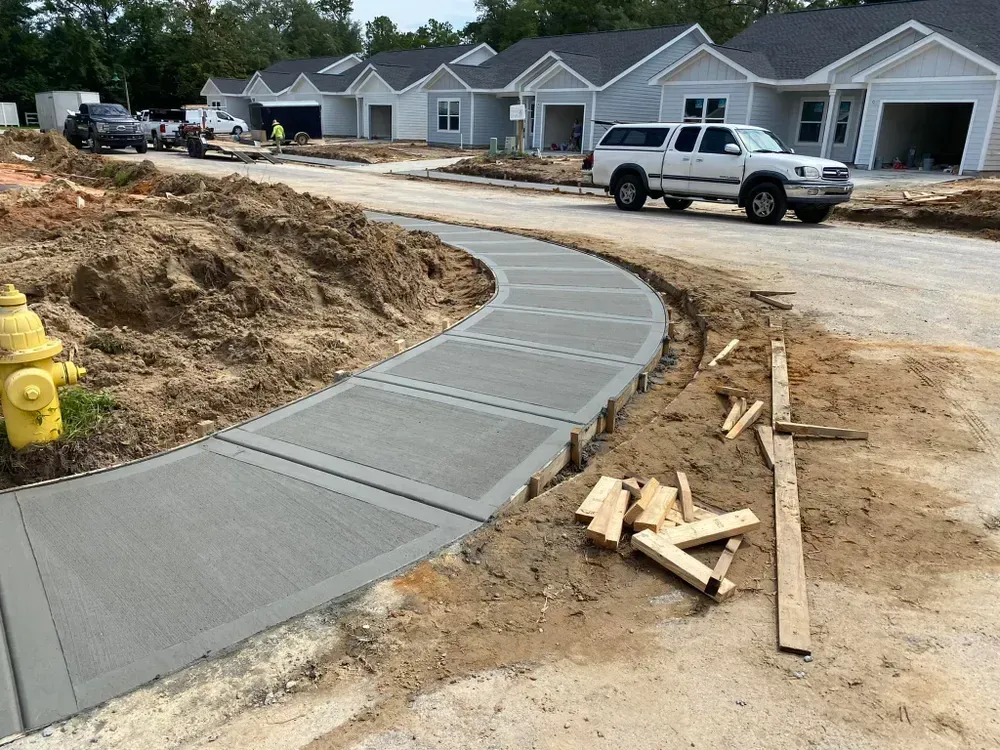 A white truck is parked on the side of the road next to a fire hydrant.
