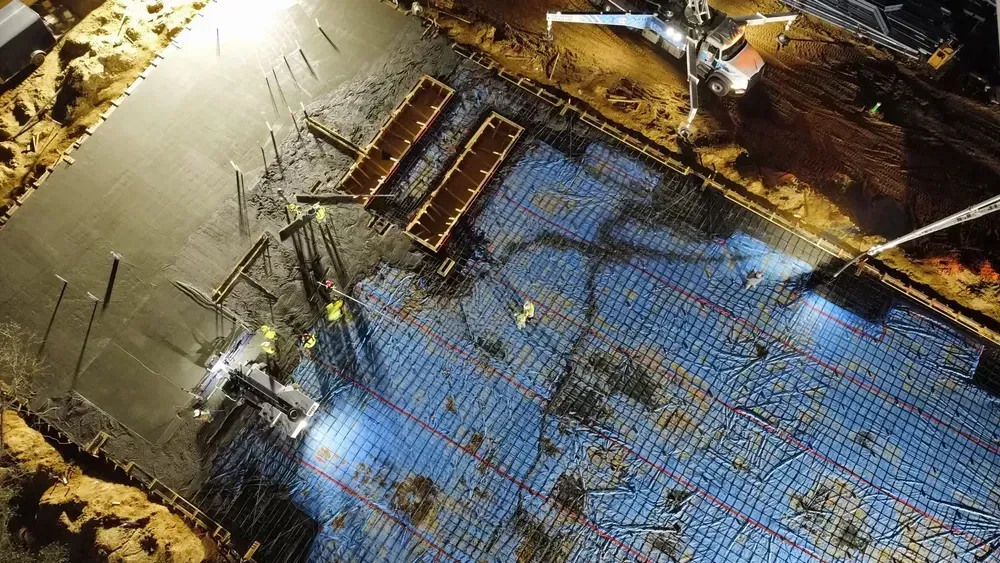 An aerial view of a construction site at night.