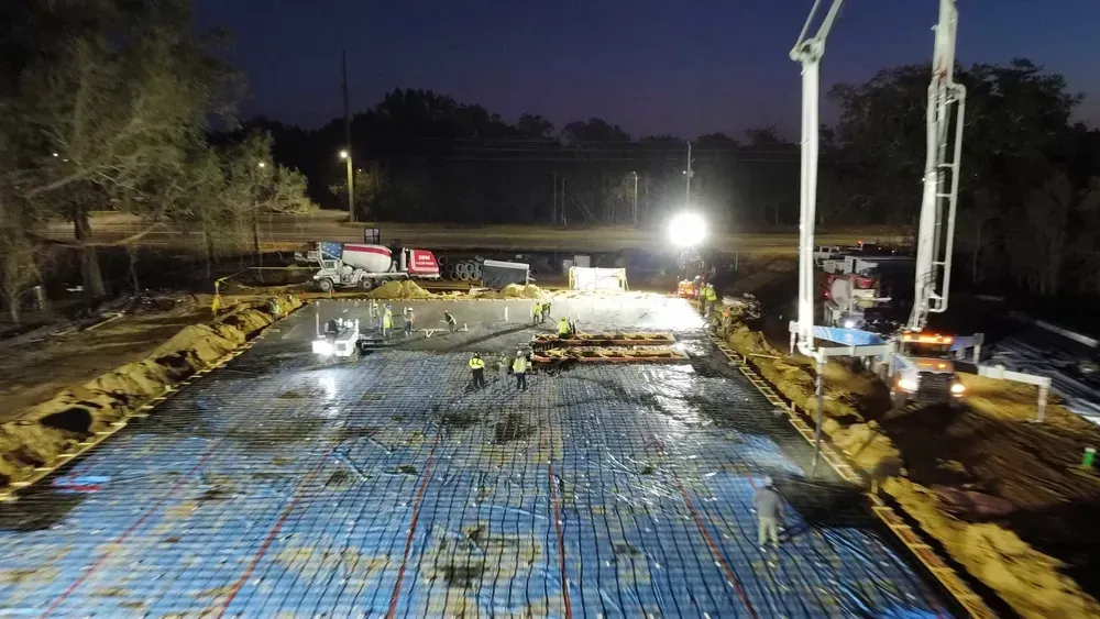 An aerial view of a construction site at night.