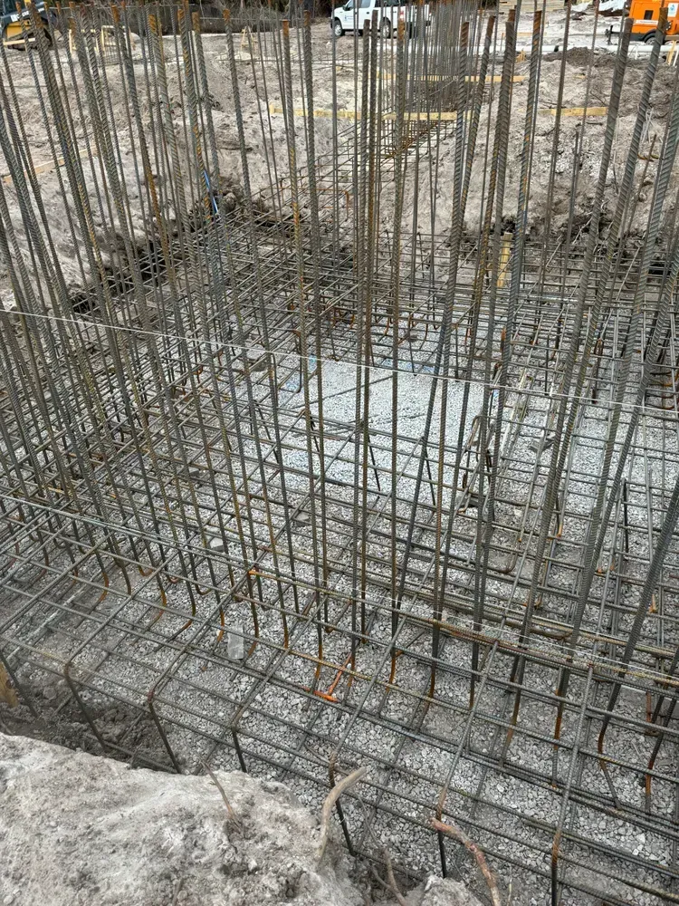 A close up of a metal fence on a construction site.