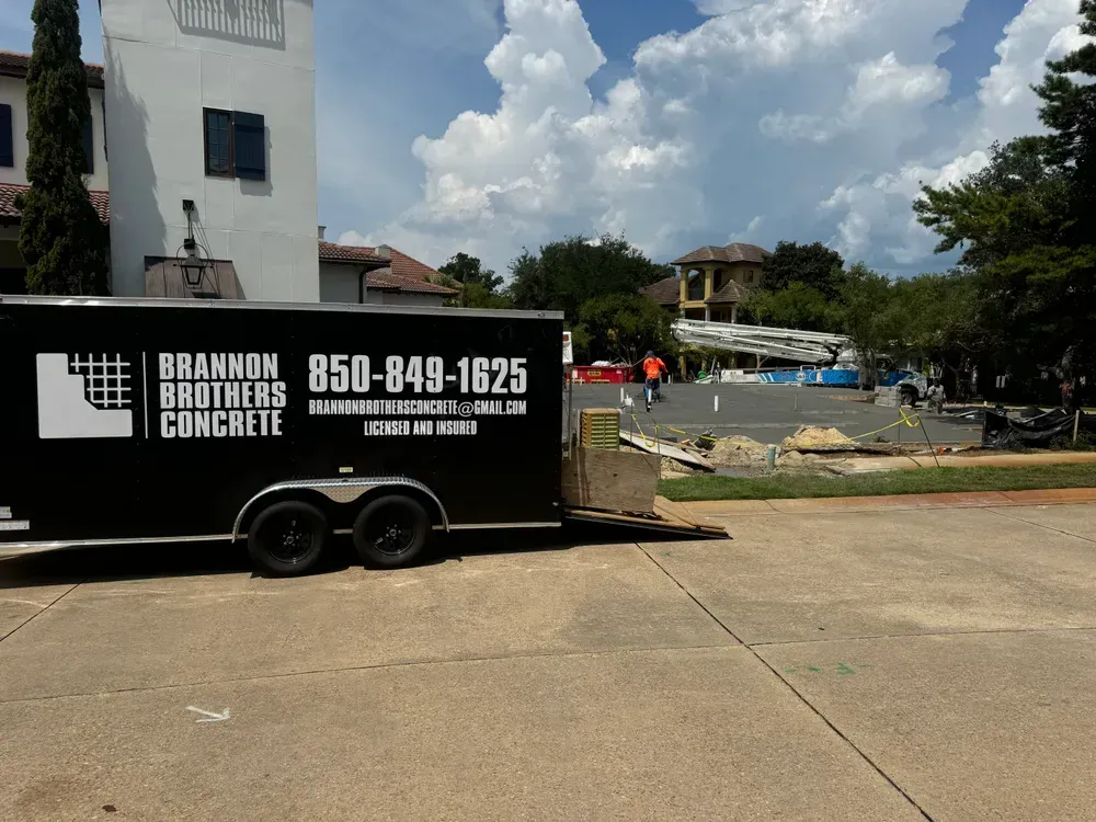 A brandon brothers concrete trailer is parked in a driveway