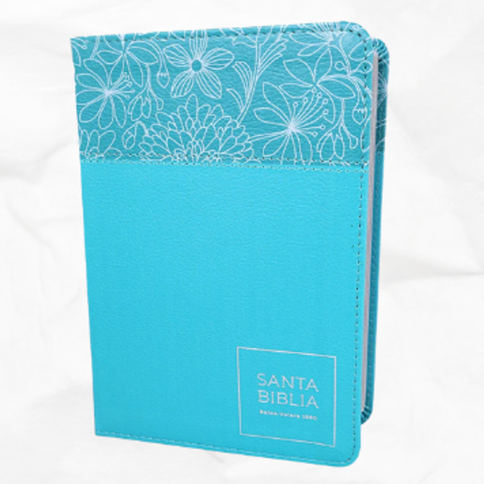 Biblia azul con acentos florales; logotipo "Santa Biblia".
