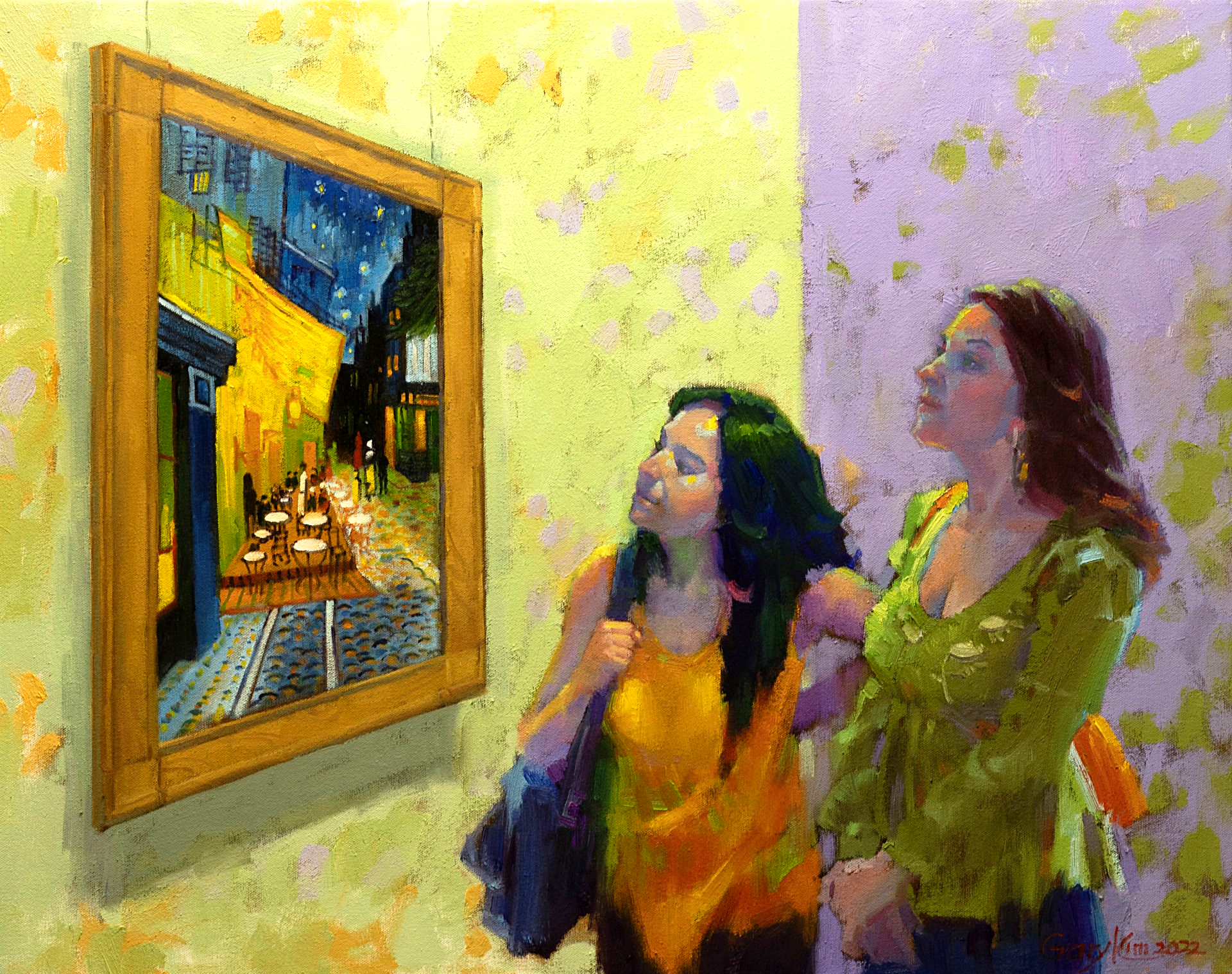 Two women are looking at a painting on a wall