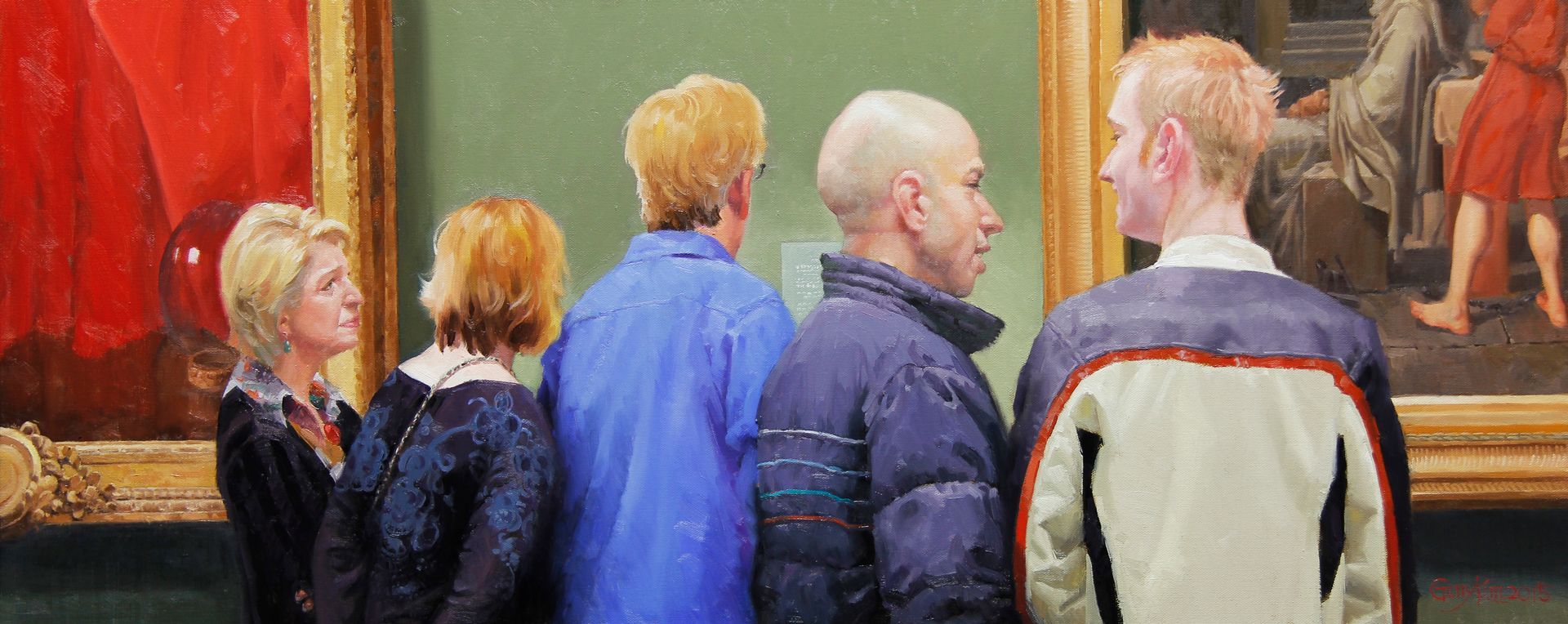 Two women are looking at a painting on a wall