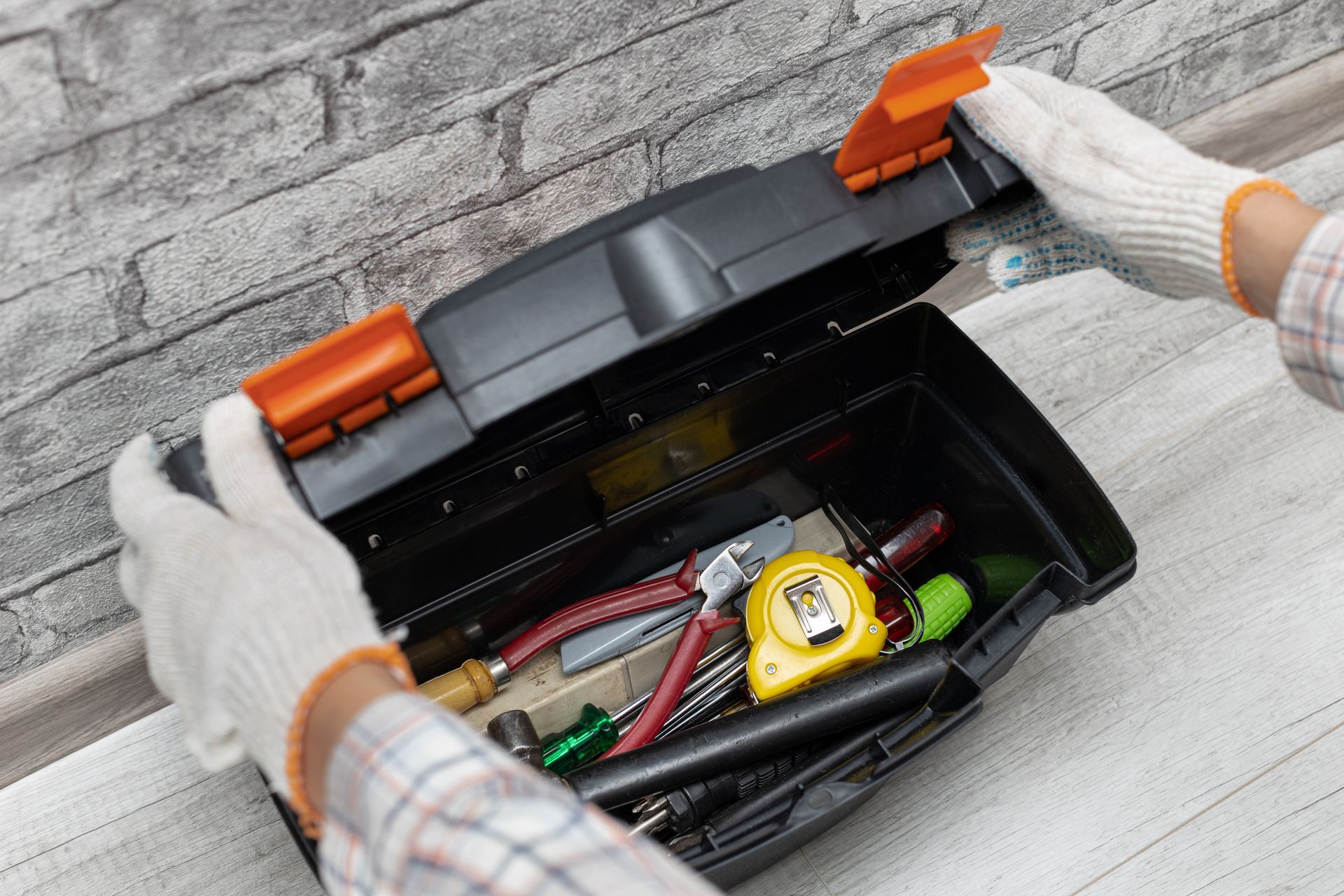 Two Hands Opening Tool Box During Commercial AC Service
