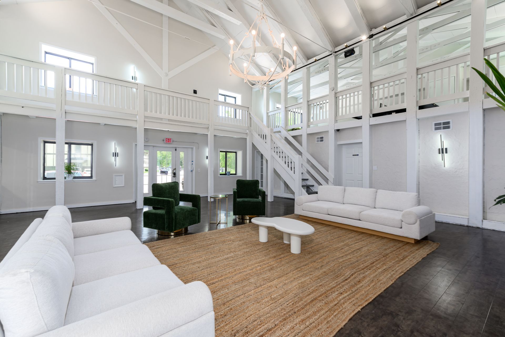 A living room filled with furniture and a chandelier.