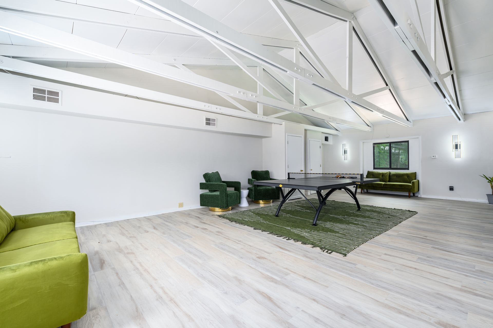 There is a ping pong table in the middle of the room.