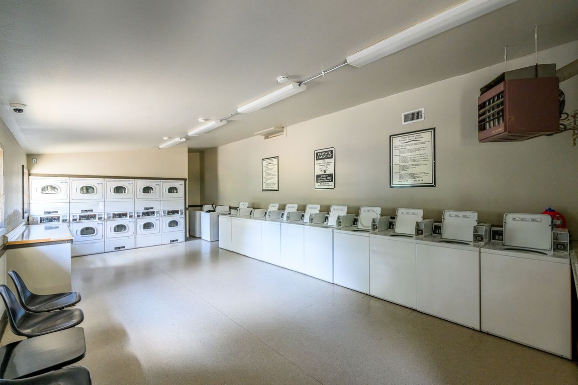 A laundromat with a lot of washers and dryers