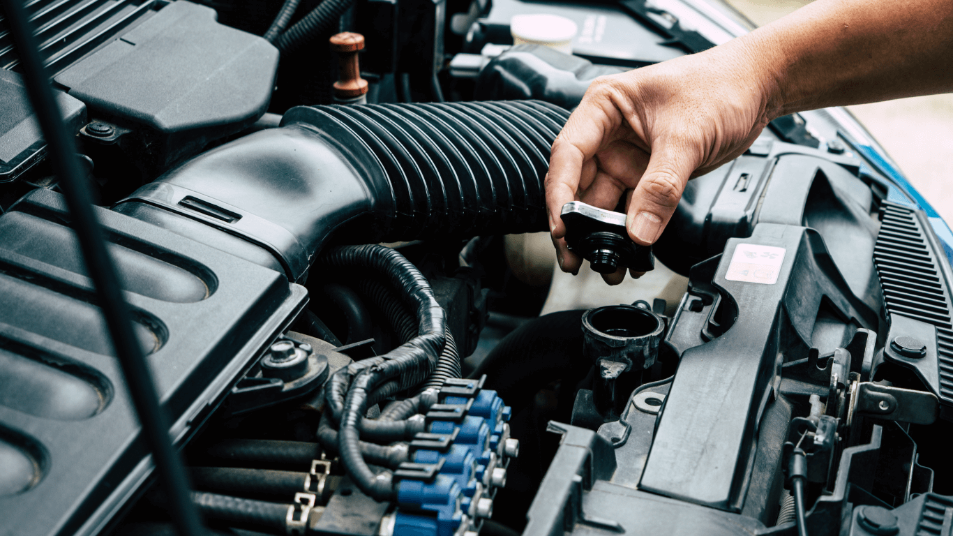 a mechanic changing radiator fluid