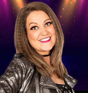 A woman in a silver jacket and choker is smiling for the camera.