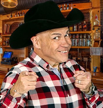 A man wearing a cowboy hat and plaid shirt is pointing at the camera.