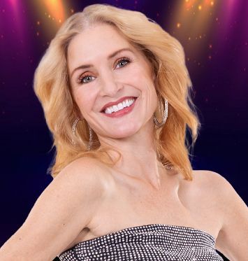 A woman wearing a choker and earrings is smiling for the camera.