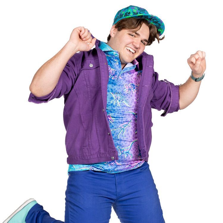 A man wearing a purple jacket and a blue shirt