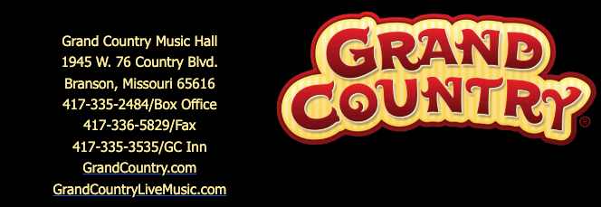 A sign for grand country music hall in branson missouri