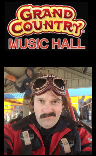 A man in a cowboy hat is playing a keyboard at the grand country music hall