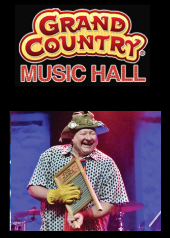 A man in a cowboy hat is playing a keyboard at the grand country music hall