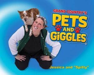 Two performers in traditional German-style dresses stand on a stage with a band against a red, starlit backdrop.