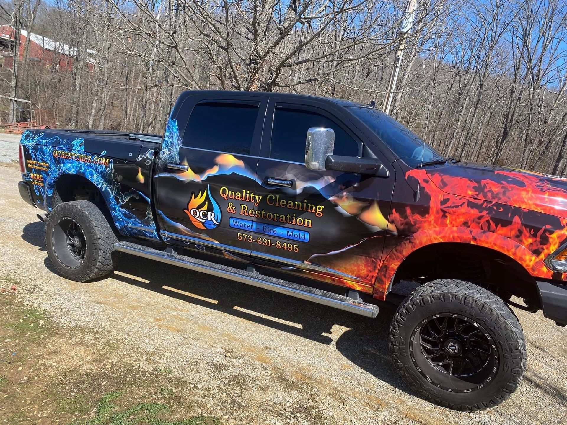 Black pickup truck with fire and ice wrap, 