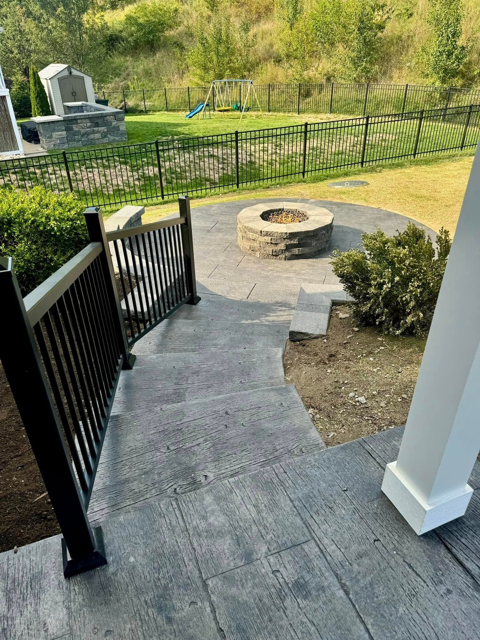 There is a fire pit in the middle of the patio.