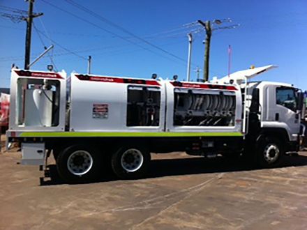 A large white truck is parked in a parking lot