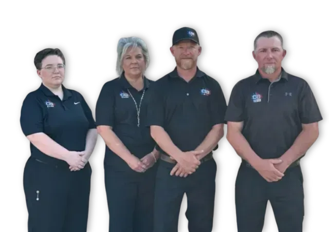 Four people in black shirts with logo, hands clasped, posing outside.