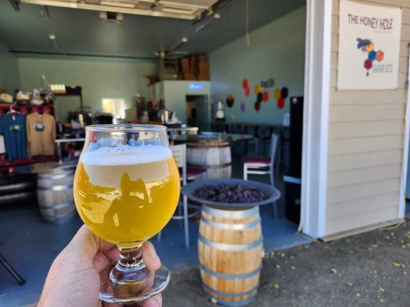 Glass of mead in front of Cloud City modern mead taproom