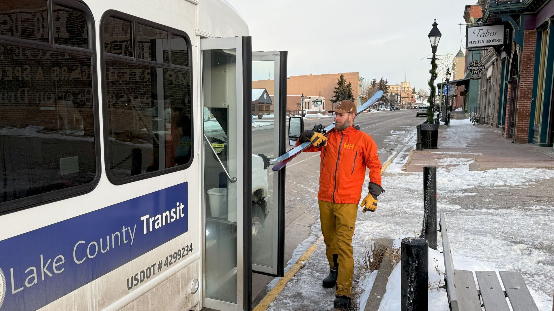 A man is getting off a lake county transit bus