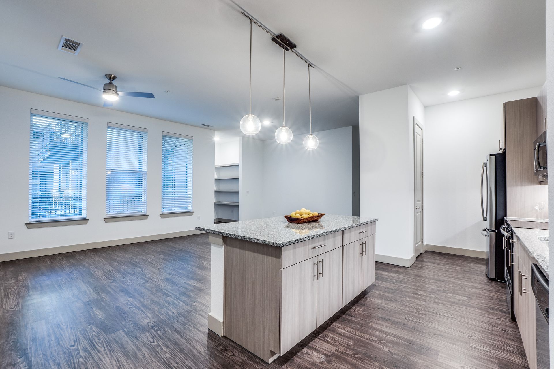 A kitchen with a large island in the middle of the room.