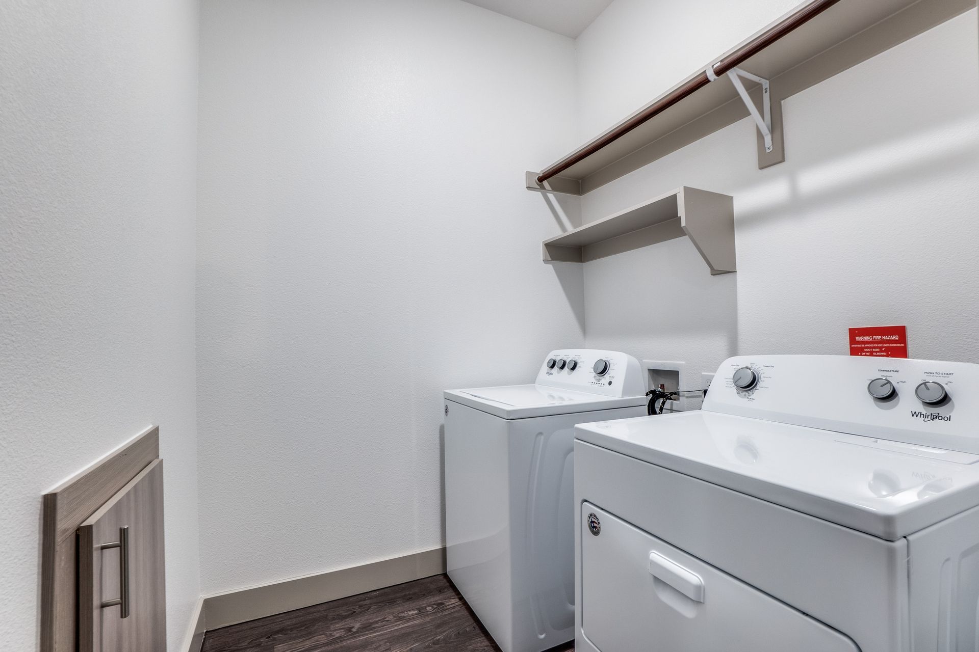 A laundry room with a washer and dryer in it.