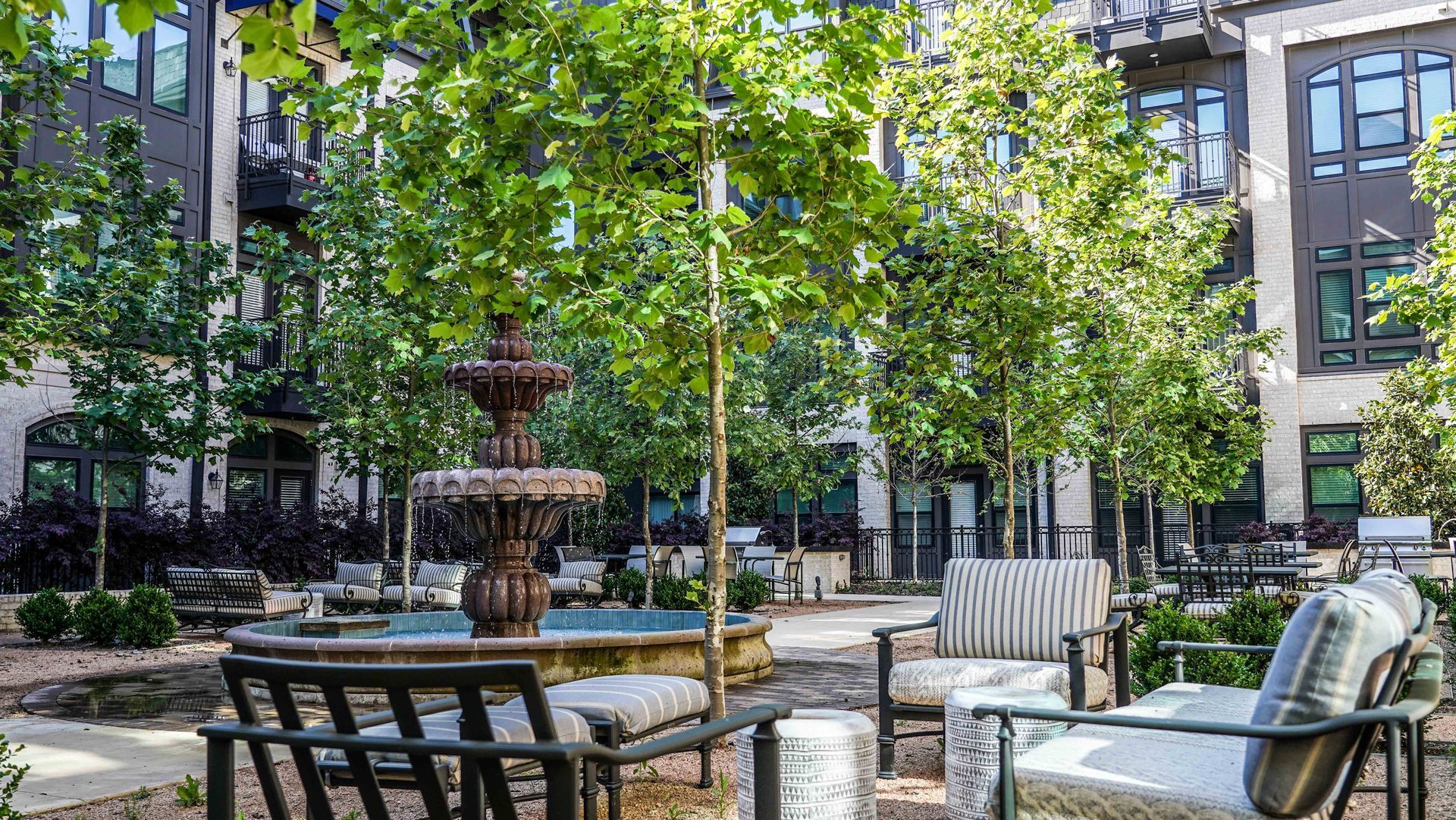 There is a fountain in the middle of the courtyard.