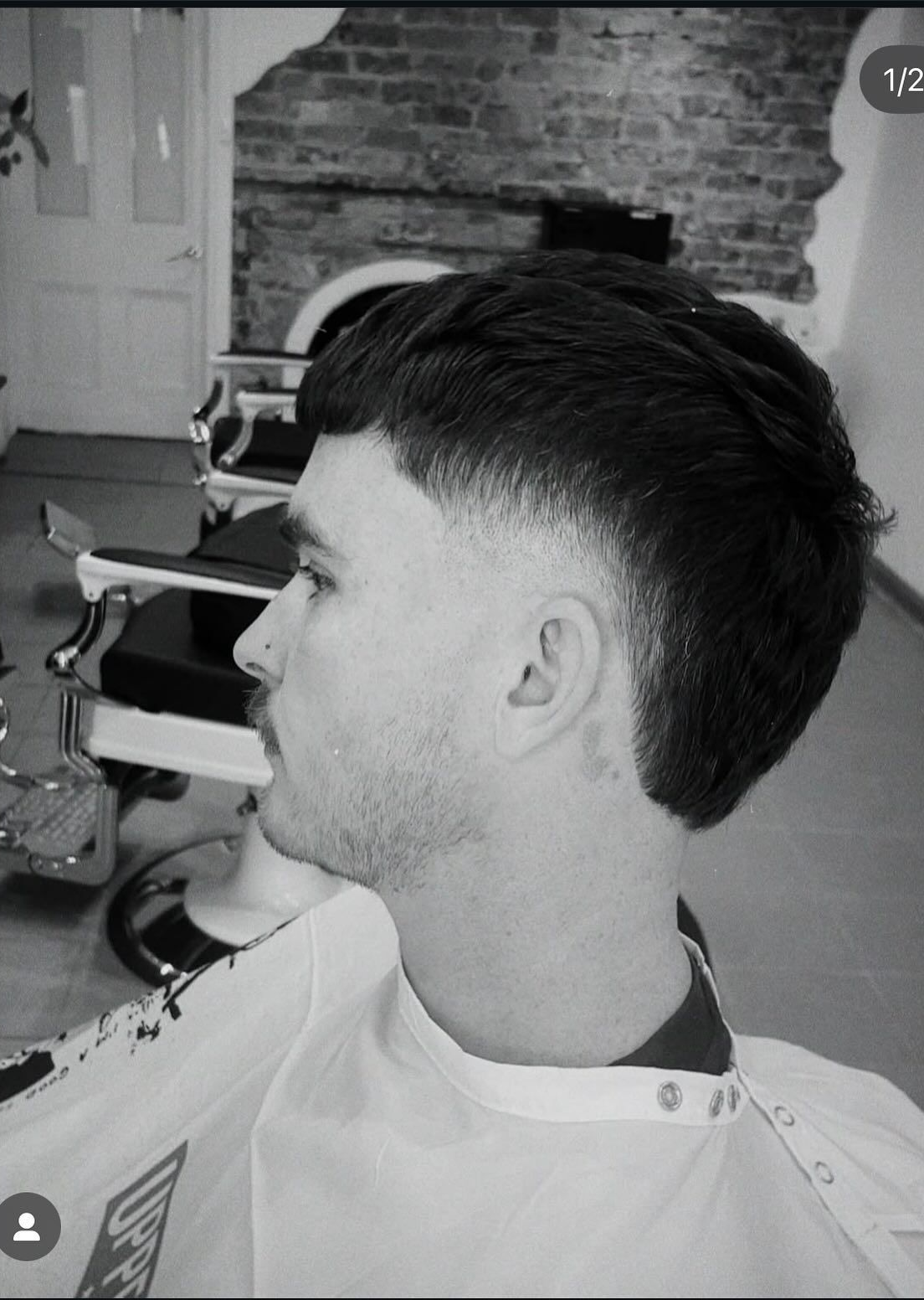 Man with faded haircut in barber shop. — Eagle Tamer Barbershop in Stratford, QLD