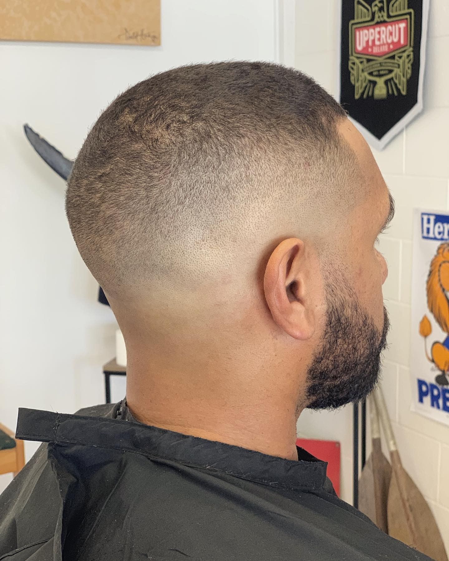 Man Getting a Haircut at a Salon; Scissors and Comb in Use — Eagle Tamer Barbershop in Stratford, QLD