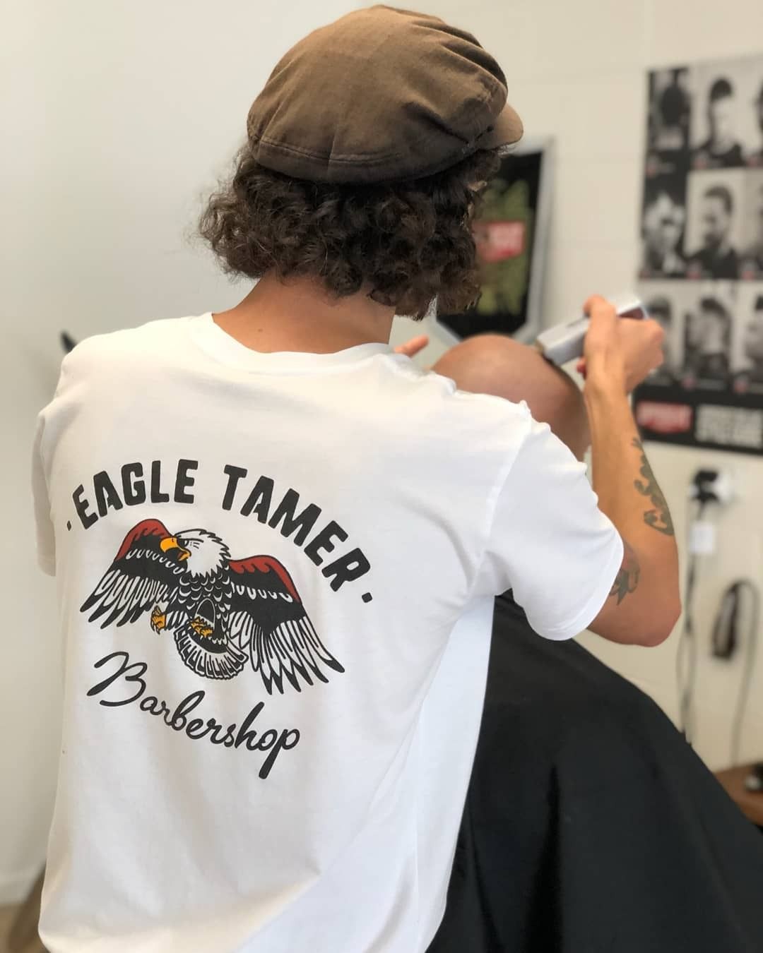 Man Getting a Haircut With Clippers at a Barbershop — Eagle Tamer Barbershop in Stratford, QLD