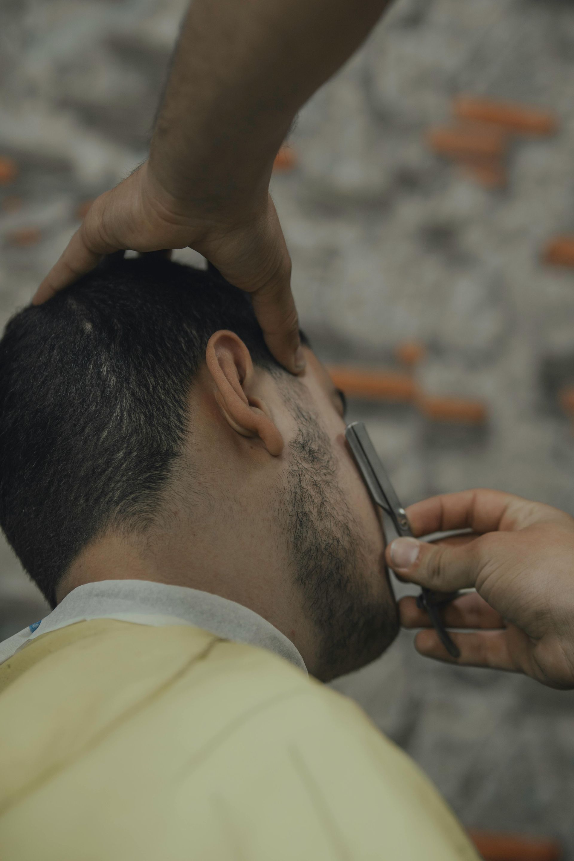 Man With Beard Wearing Glasses and Gray Blazer, Outdoors — Eagle Tamer Barbershop in Stratford, QLD