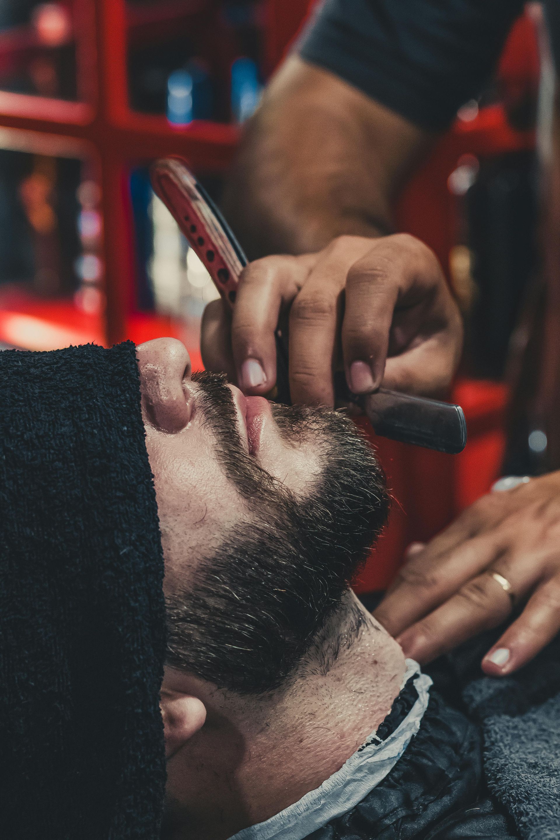 Barber Applying Shaving Cream to a Man's Face in a Barbershop — Eagle Tamer Barbershop in Stratford, QLD
