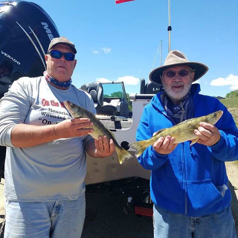 men holding their catches