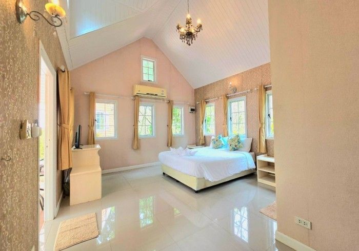 There is a large bed in the middle of the room.