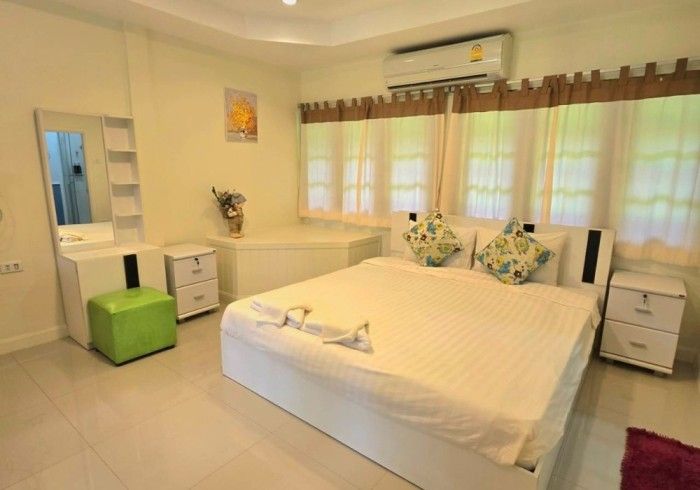 There is a large bed in the middle of the room.