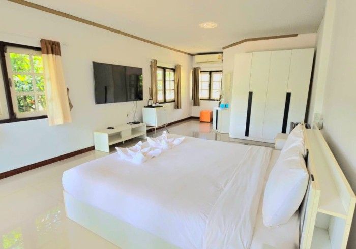 There is a large bed in the middle of the room.