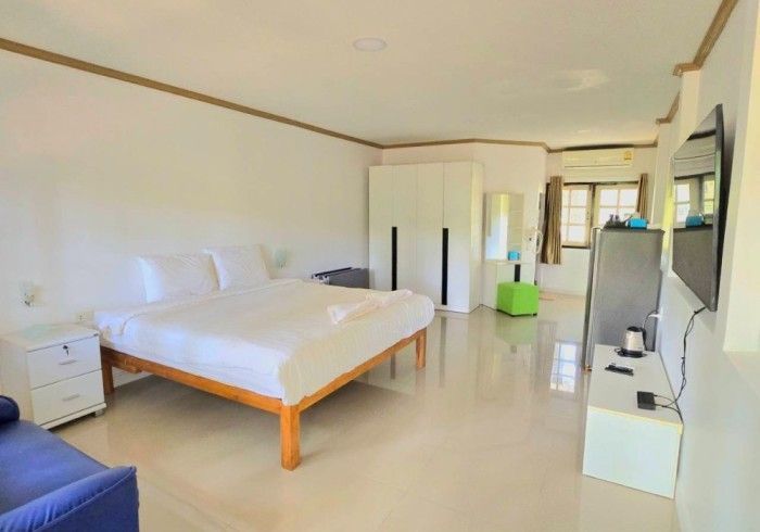 There is a large bed in the middle of the room.