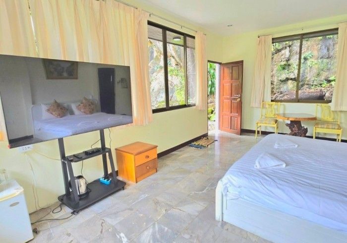 There is a large flat screen tv in the middle of the room.